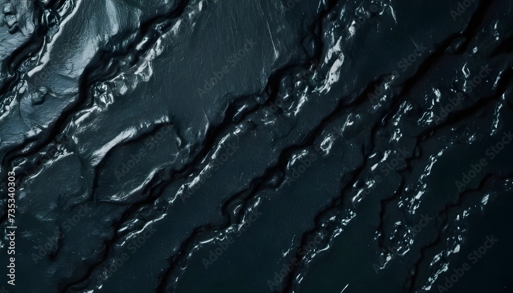 Fototapeta premium Dark obsidian lavic rock surface texture, black, smooth, shiny