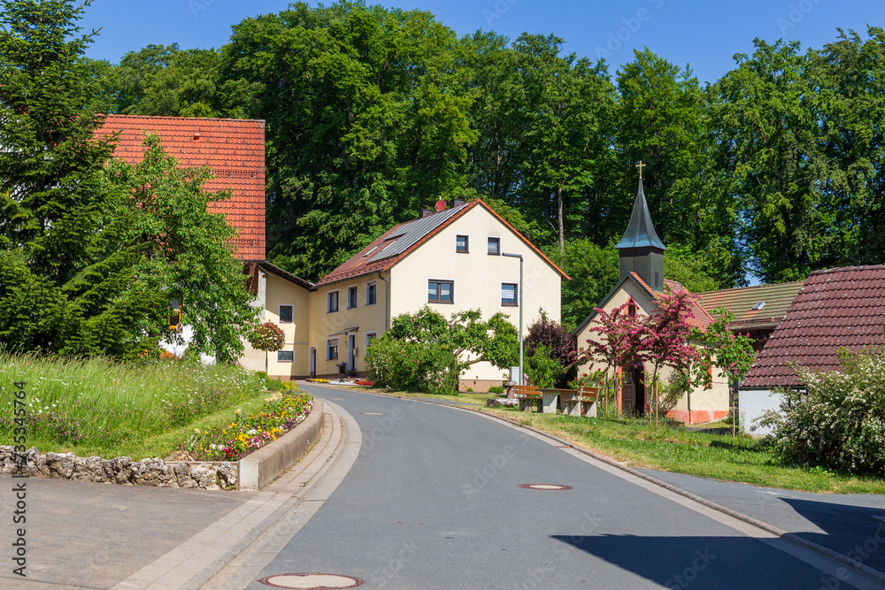 Houses, chapel and trees in village Leienfels, district of Pottenstein (Franconian Switzerland), Bavaria, Germany
