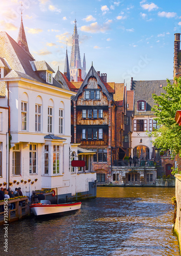 Bruges, Belgium. Ancient medieval architecture of brugges. Old stone and wooden houses above water channels in Brugge. Historic town, famous european landmark. © Yasonya