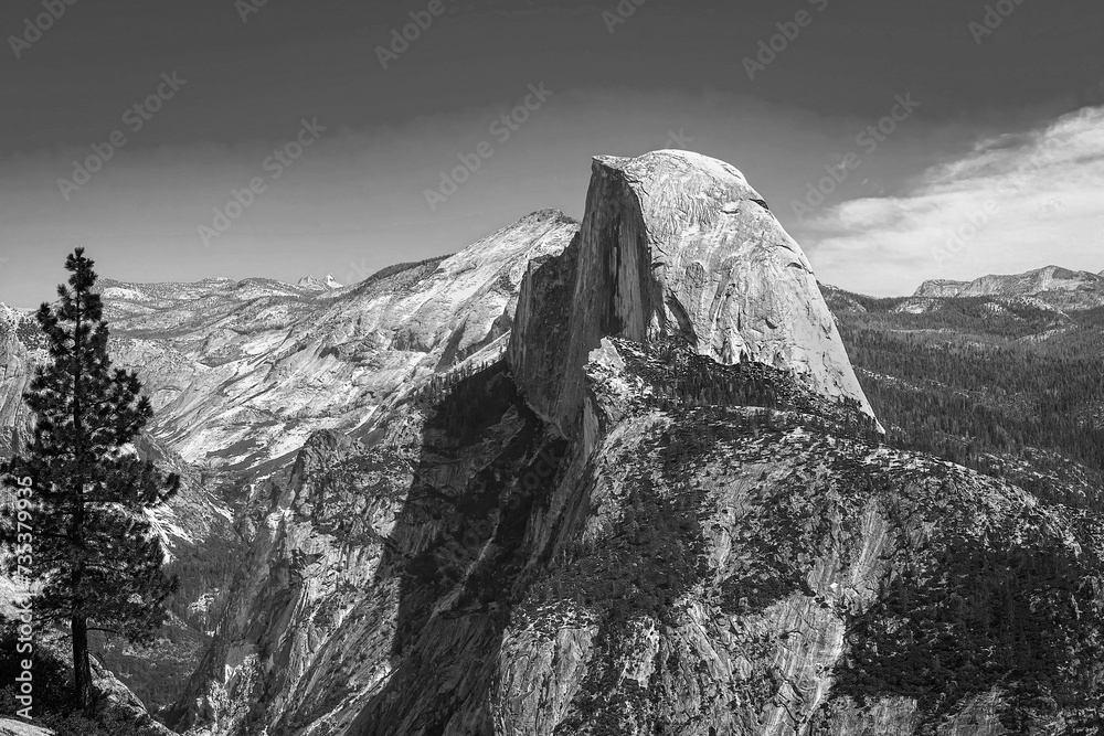 Classic black and white landscape art of Half Dome and valley landscape during summer season in Yosemite National Park California, USA.