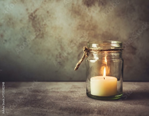 candle in glass jar.