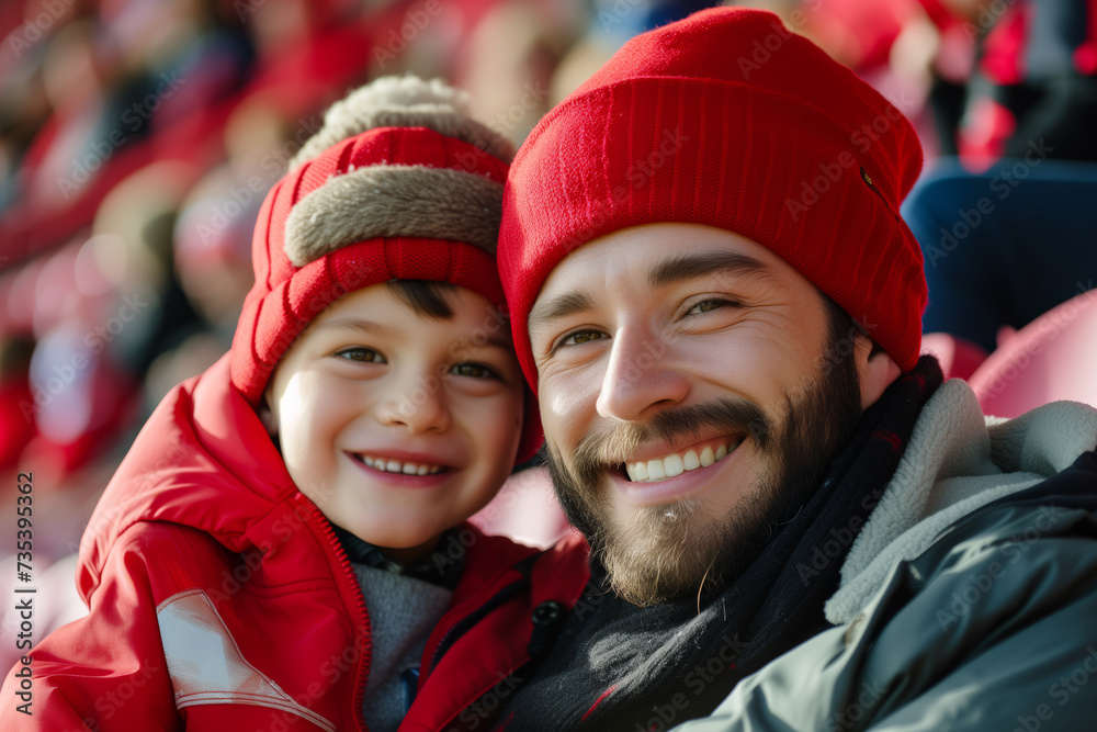 Father and son at the stadium cheering for their favourite team