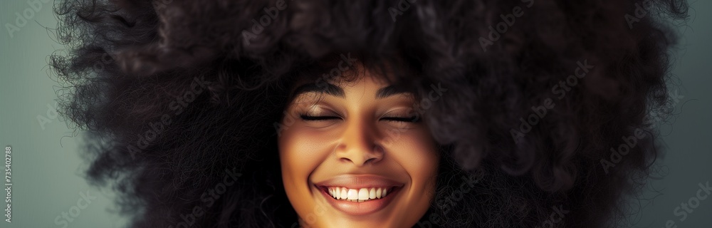 close up portrait of a happy african american woman with big afro hair style