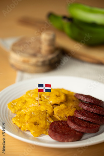 dominican fried plantains and salami with a flag
