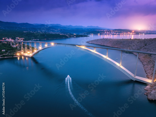 Bridge over the sea at sunset. Aerial view of modern Krk bridge photo