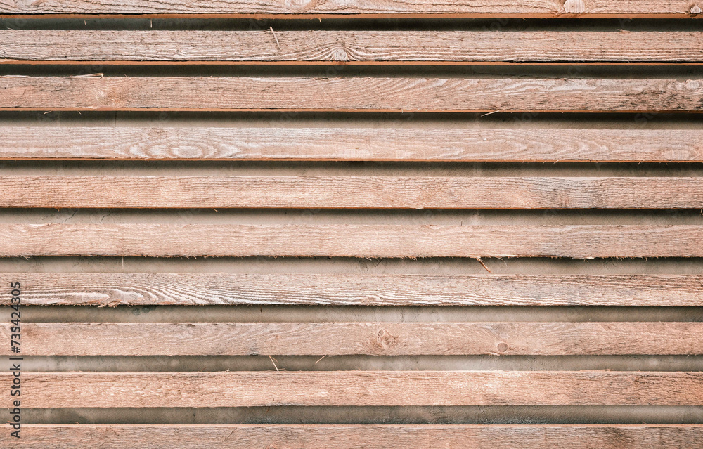 Decorative wood panels on wall in modern exterior. Detail in minimalist design at house and decoration from natural wooden materials Decorative wood panels on wall in modern exterior. Detail in minimalist design at house and decoration from natural wooden materials
