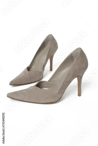 Suede leather pumps isolated on white. Classic high heels with sharply pointed toes.