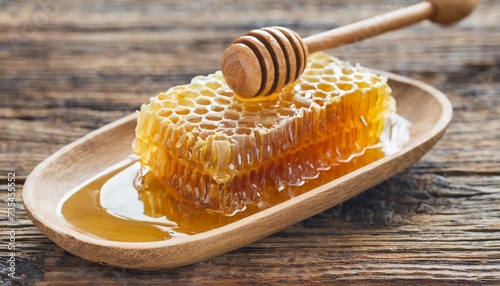 honey with honeycomb and wooden spoon