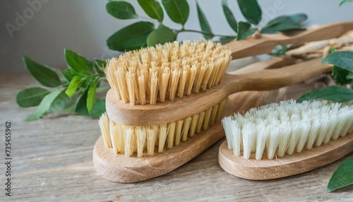 set of wooden bamboo brushes for washing dishes and cleaning home zero waste eco friendly cleaning concept soft focus image