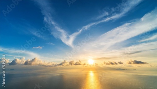 beautiful blue sky and white fluffy cloud with sunrise in the morning natural background