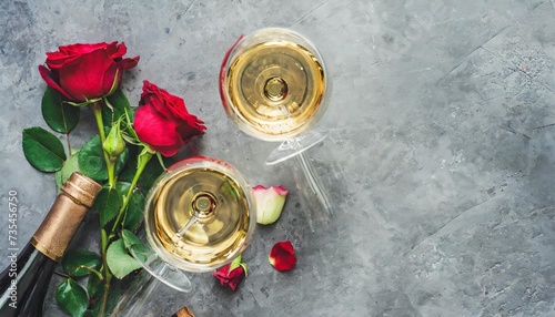 flat lay of red rose and white wine in glasses over grey concrete background top view wine bar winery wine degustation concept