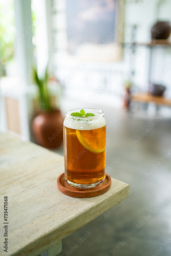 Fresh cold lemon tea on a table in an elegant cafe Fresh cold lemon tea on a table in an elegant cafe