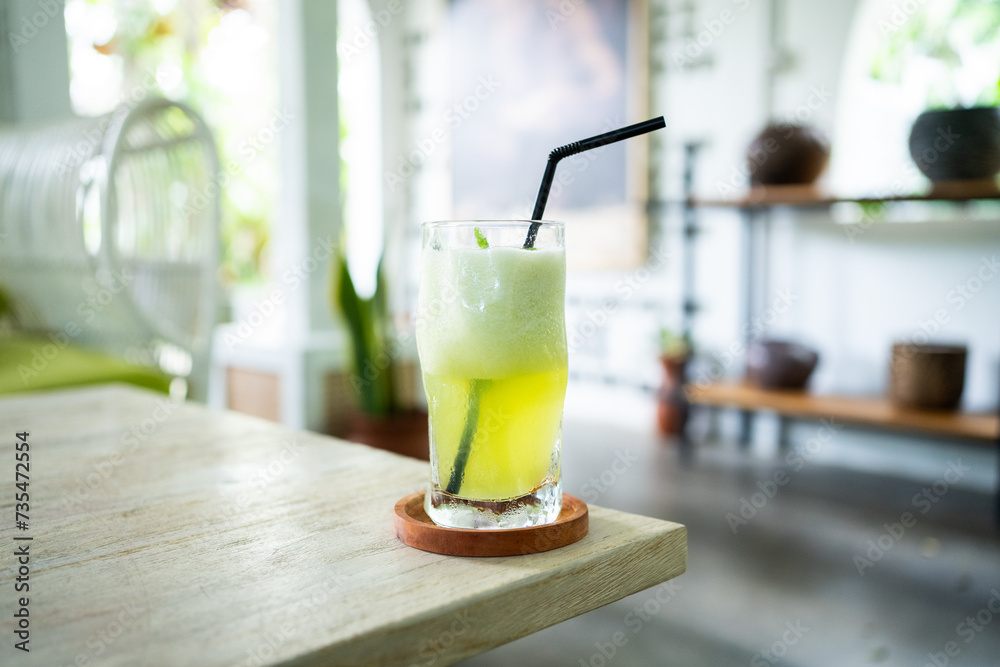 fresh cold melon juice on a table in an elegant cafe. fresh cold melon juice on a table in an elegant cafe.