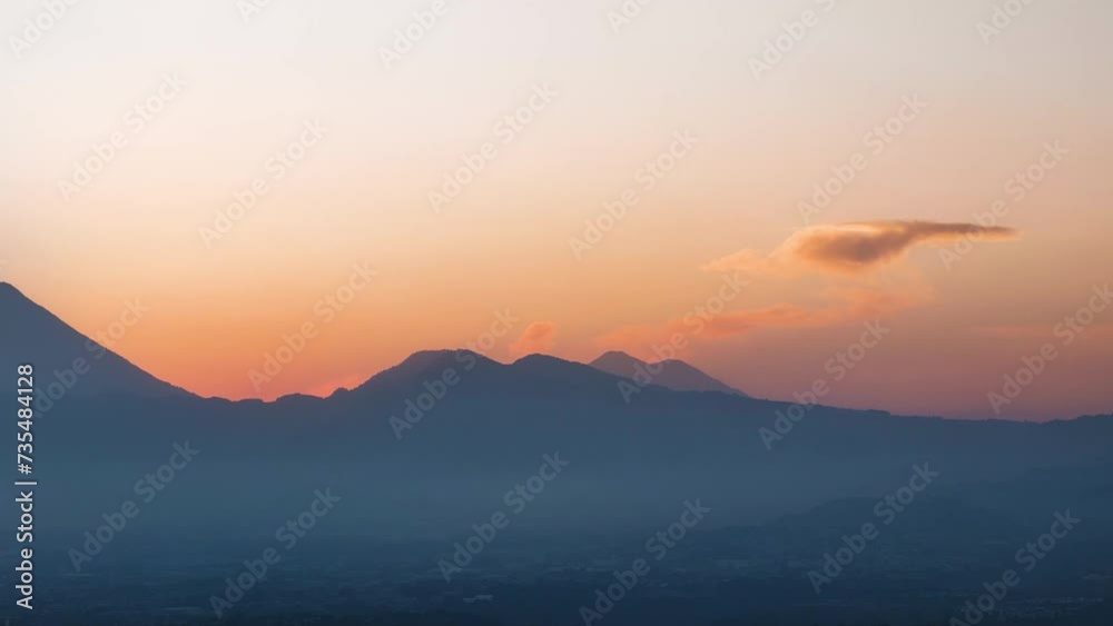 Aerial shot of sunset on a summer evening in Guatemala City with the volcano in the background. Aerial shot of sunset on a summer evening in Guatemala City with the volcano in the background.