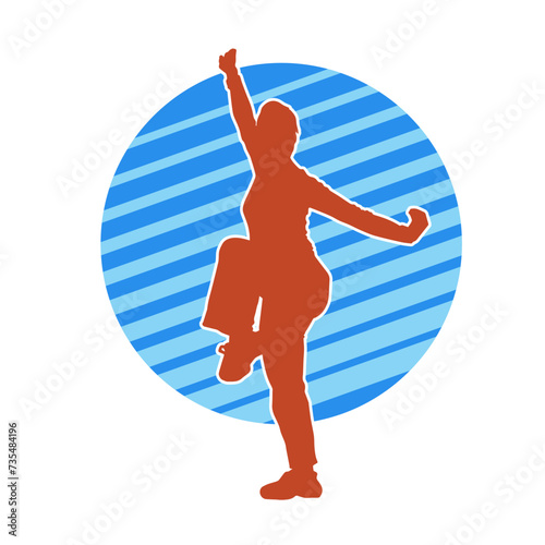 Silhouette of a slim female doing martial art pose. Silhouette of a martial art woman in action pose.
