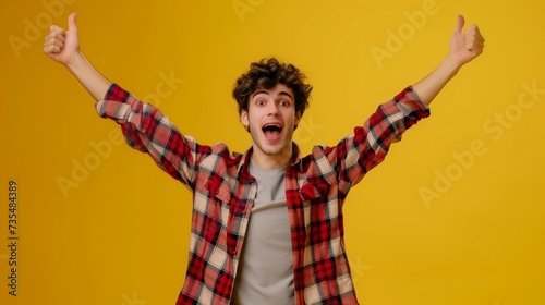 Portrait of funny funky youth millennial raise arms rejoice funny funky free time weekends holidays glad content scream shout dressed modern denim plaid outfit isolated yellow background photo