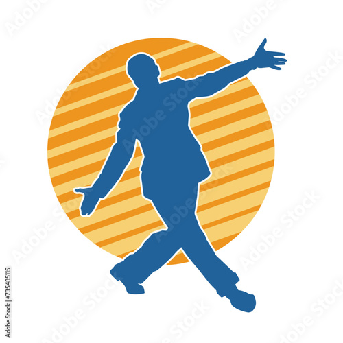 Silhouette of a man in dancing pose. Silhouette of a male dancer in performing pose.