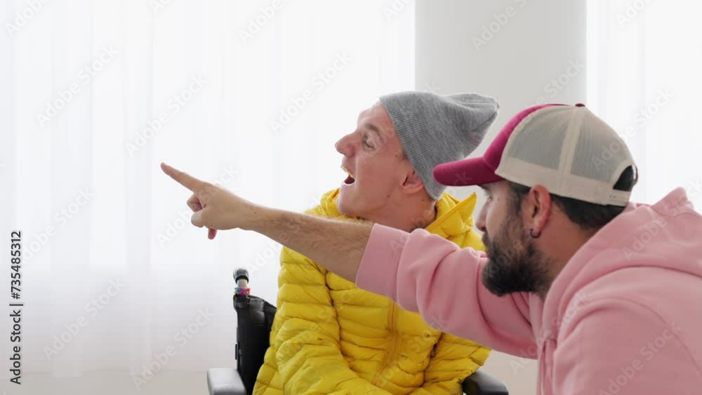 Vidéo Stock Handicapped man on wheelchair having fun with caregiver ...