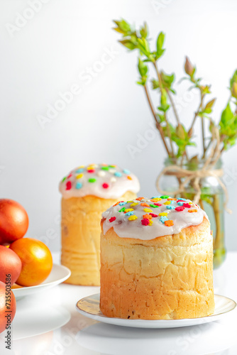 Sweet Easter cake panettone with icing and golden eggs.