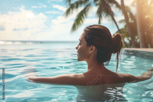 Sensual young woman in swimming pool. Woman on tropical vacation paradise on sea. Summer sea background. Summer vacation travel holiday background concept