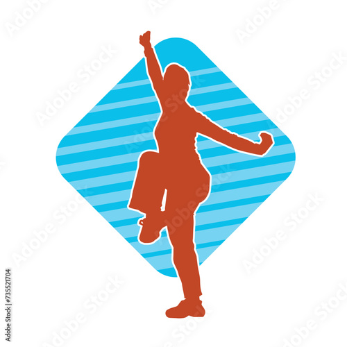 Silhouette of a slim female doing martial art pose. Silhouette of a martial art woman in action pose.
