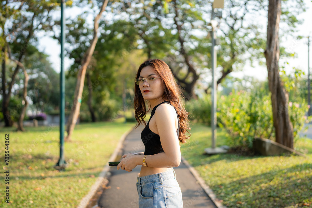 Portrait of asian woman relax in city park sunset light sky Portrait of asian woman relax in city park sunset light sky