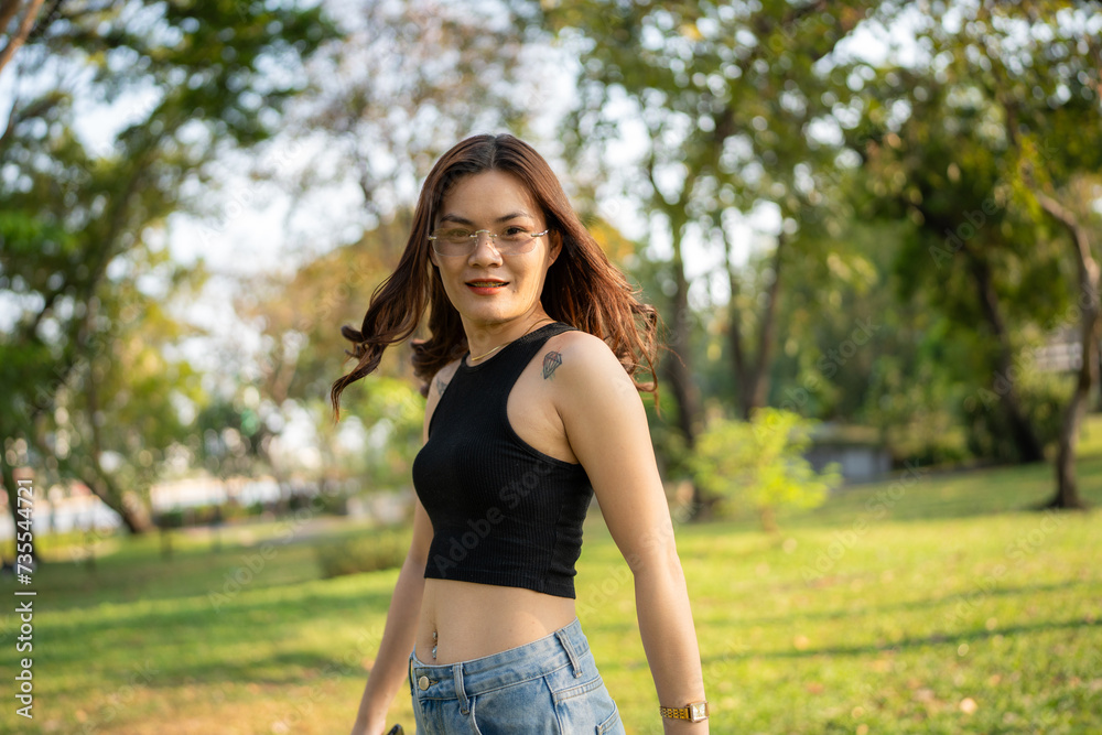 Portrait of asian woman relax in city park sunset light sky Portrait of asian woman relax in city park sunset light sky
