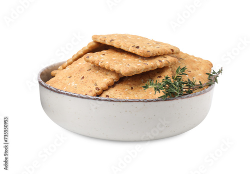 Cereal crackers with flax, sesame seeds and thyme in bowl isolated on white
