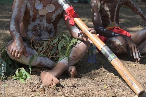 Indigenous Australians play didgeridoo on Ceremonial dance in Laura Quinkan Dance Festival Cape York Queensland Australia photo