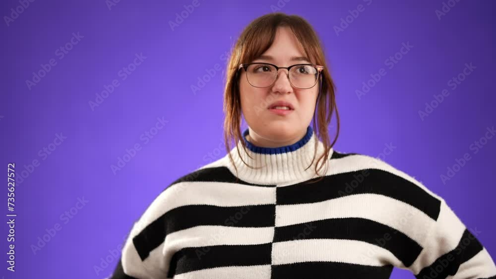 Portrait of angry frustrated despair upset unhappy young woman 20s isolated isolated on purple background.