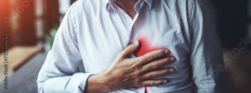 Businessman chest pain from heart attack. Healthcare concept photo