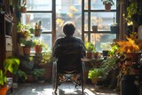 Person in a wheelchair enjoying the tranquility of a sunny home garden