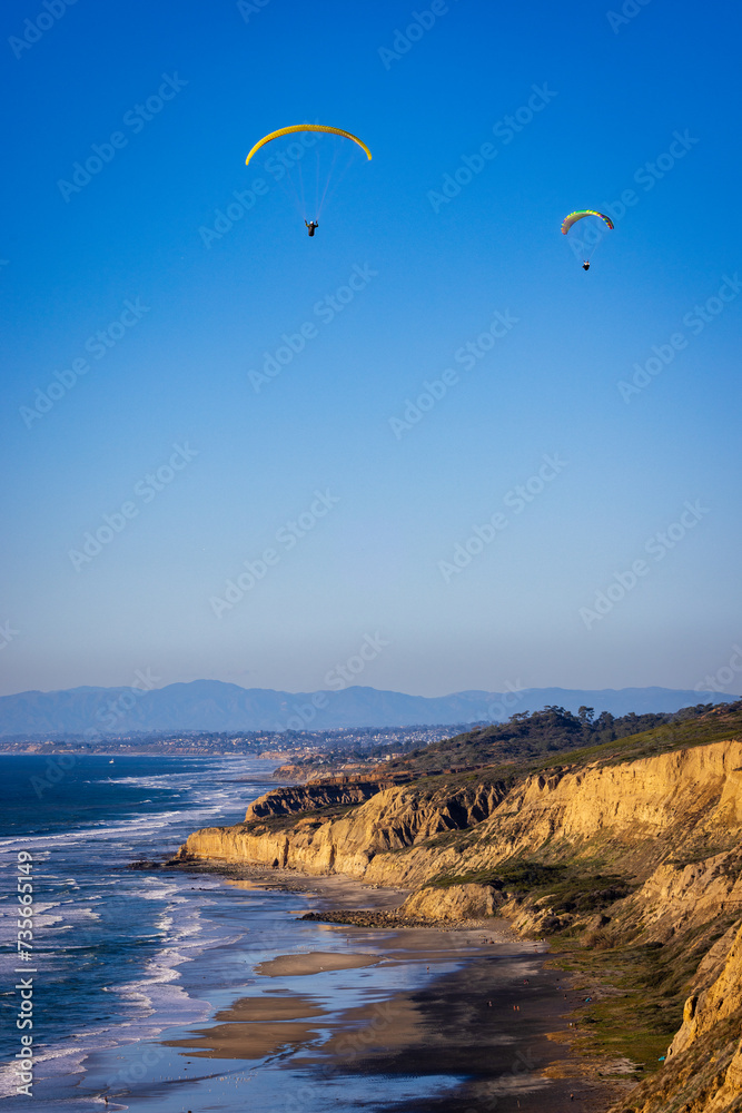 The black beach with paraglider The black beach with paraglider