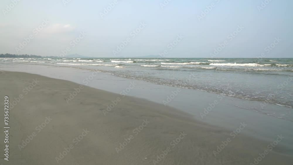 Landscape view of sea waves slowly rolling towards sandy beach. Slow motion. Landscape view of sea waves slowly rolling towards sandy beach. Slow motion.