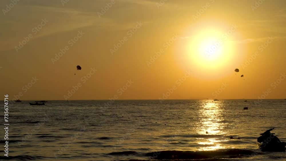 Langkawi, Malaysia – February 10, 2024 : Langkawi island in Malaysia, Chenang beach in the evening, people walk along the beach Langkawi, Malaysia – February 10, 2024 : Langkawi island in Malaysia, Chenang beach in the evening, people walk along the beach
