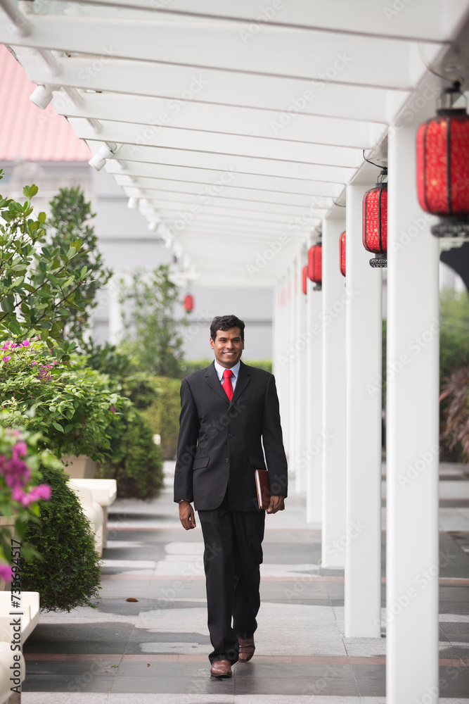 Indian business man in modern Asian city Indian business man in modern Asian city