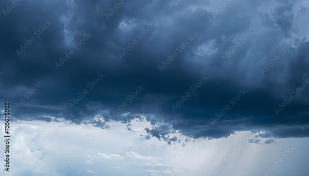Obraz premium Heavy rainfall close up. Dark blue Gloomy sky with stormy clouds in rain. Nature Dramatic Sky Background, texture for Design. Artistic Panoramic Wallpaper or Web banner With Copy Space