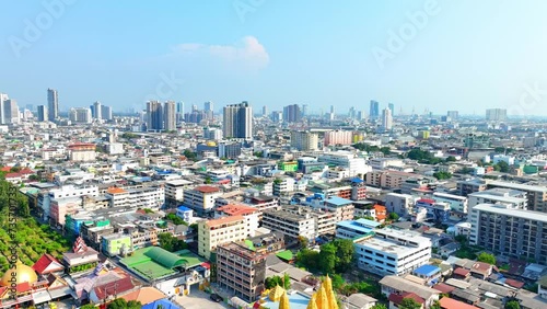 4K - Bangkok Thailand: Drone Aerial view, Drone soars above metropolitan maze, towering edifices define the urban landscape. Urban concept.
 photo