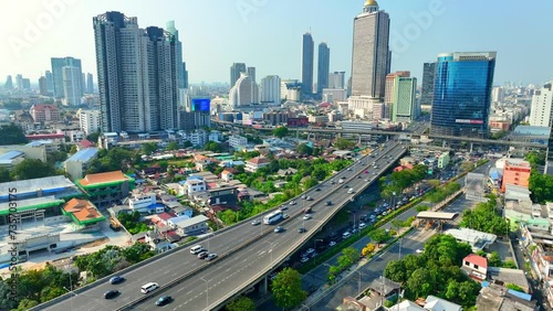 4K - Bangkok Thailand: Drone Aerial view, Slicing through the urban skyline, the drone surveys skyscrapers and high rises, capturing the city's vibrant energy from above. Travel concept.
 photo