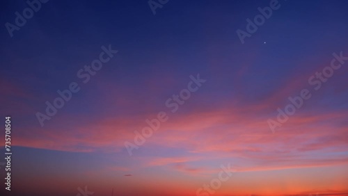 4K : Sunrise sky time lapse - A timelapse captures the majestic sunrise sky adorned with delicate wisps of clouds. Colors blend, transform, and dance across the horizon.
