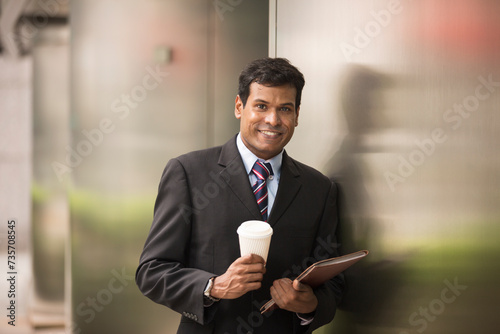 Indian businessman using digital tablet computer.