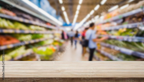 empty white wooden table with blurry supermarket activity