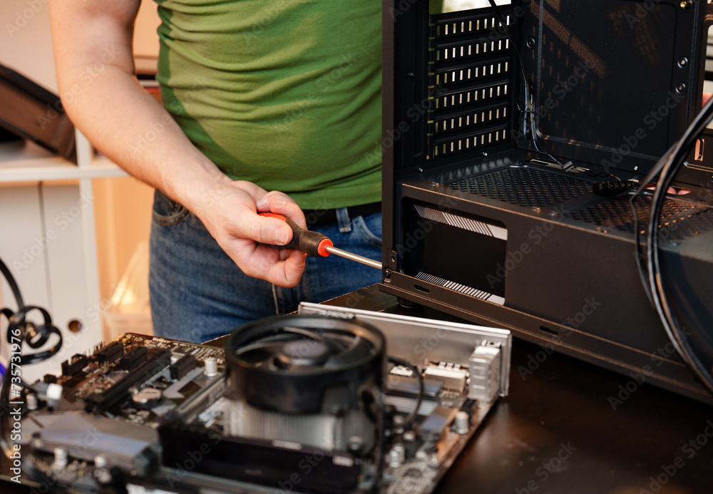 Close up of man repairing computer system unit Close up of man repairing computer system unit