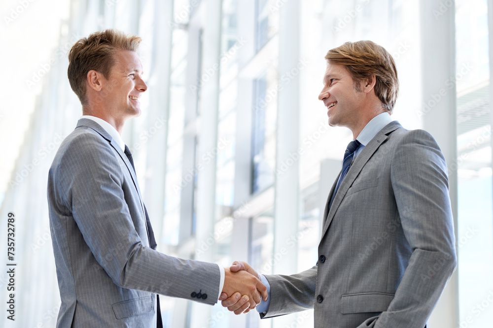 Men, colleagues and shaking hands or business agreement or collaboration on project, deal or promotion. Male people, networking and gesture for partnership at law firm or welcome, onboarding or unity
