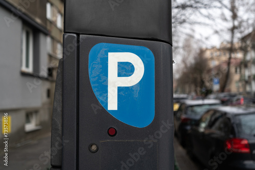 Parking meter, Parkometr or Parkomat in paid parking zone of city centre downtown district. Car park pay and display ticket machine. photo