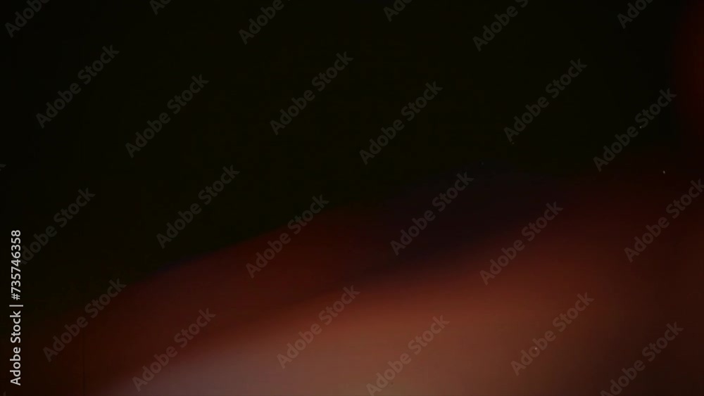 The video footage features lens flare, light leaks, and film burn effects with transitions. Utilize blending modes, such as screen mode, in video editing software