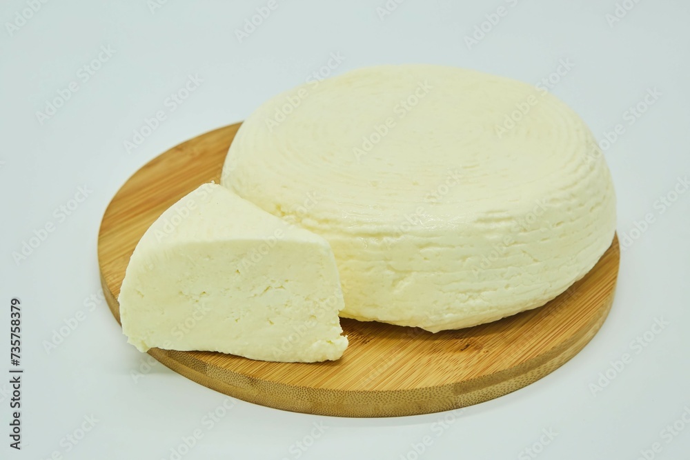 Paneer or tofu milk cheese. The product is ready to use. White background. Paneer or tofu milk cheese. The product is ready to use. White background.