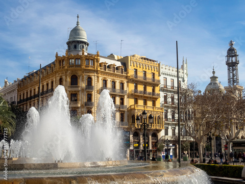 Fountain in the town hall square in the background, Noguera House (1909). Valencia, Spain.