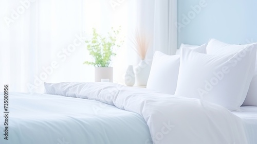 bed with white pillows and blue cover