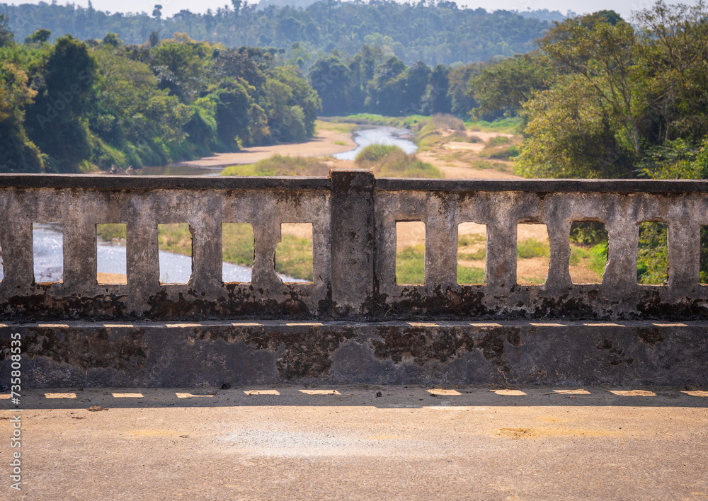 view of railing of large wide bridge over river view of railing of large wide bridge over river